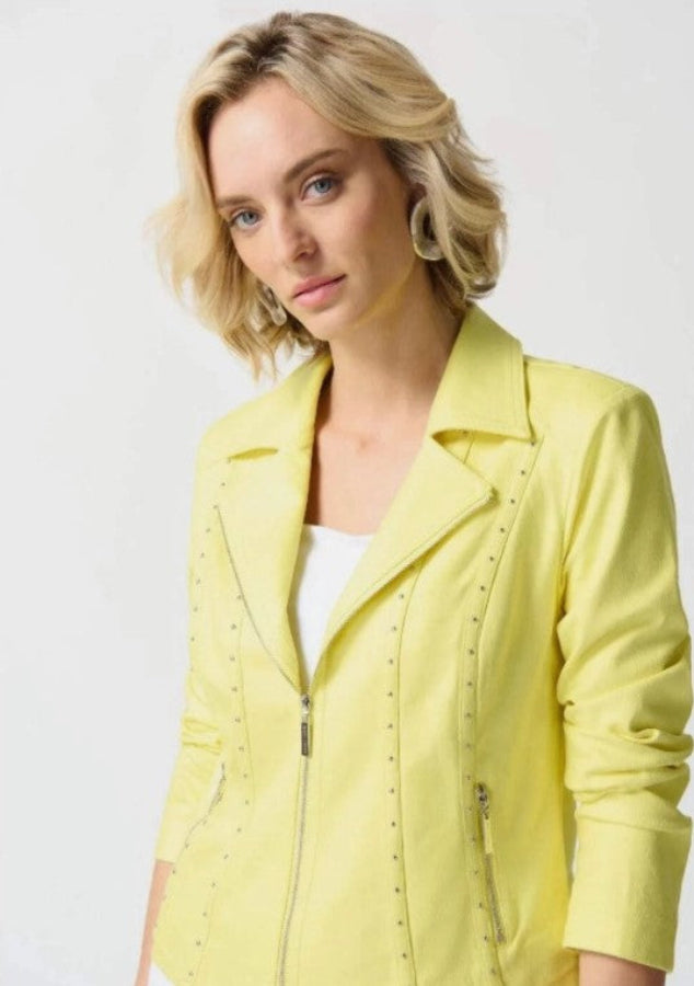 Woman wearing a yellow jacket on a white background