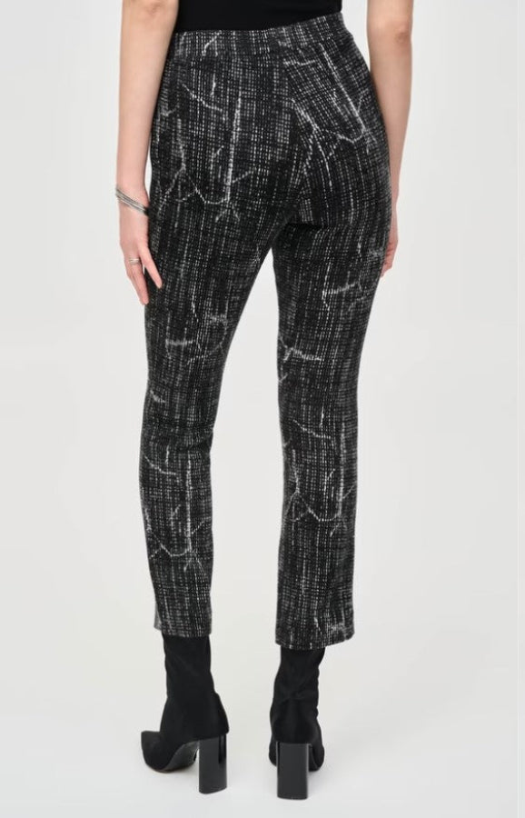 Patterned pants worn by a person on a white background