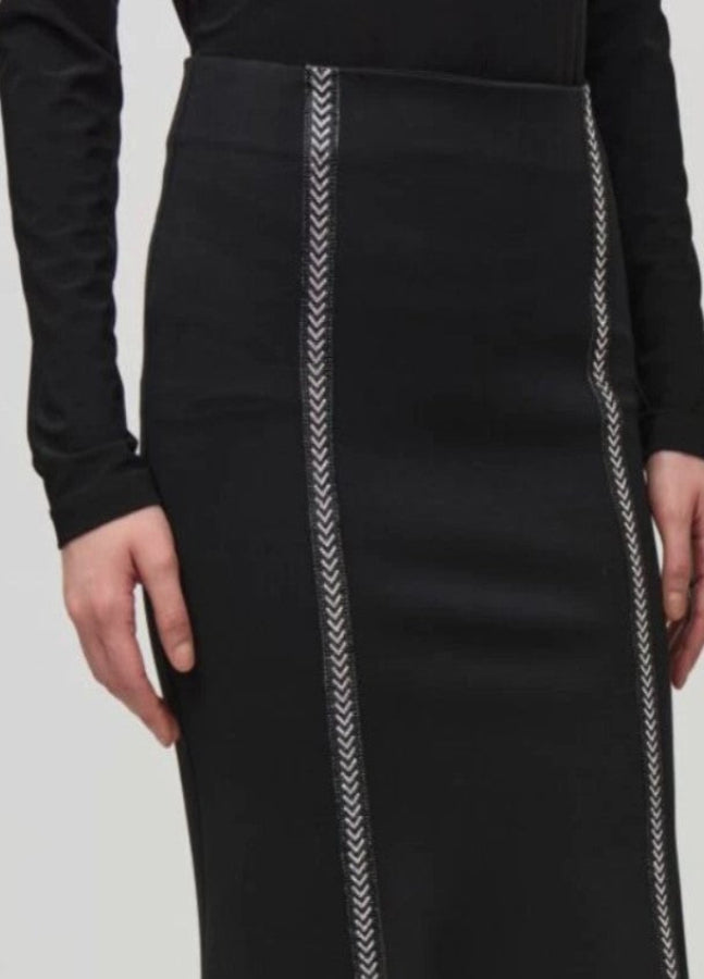 Black skirt with white stitching details on a plain background
