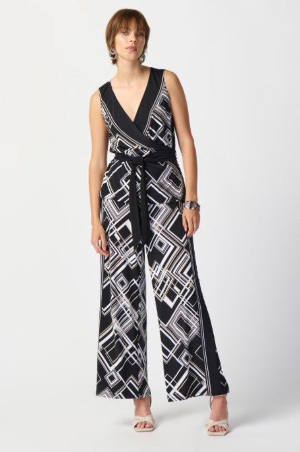 Woman wearing a black and white patterned jumpsuit on a white background