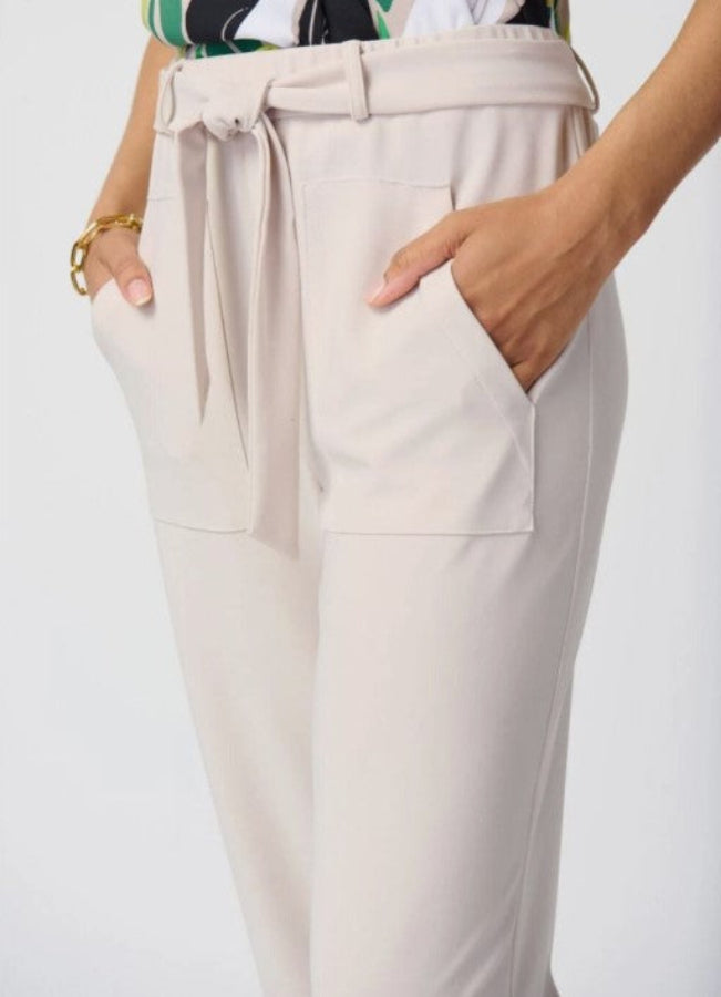 Beige pants with a tie waist on a white background