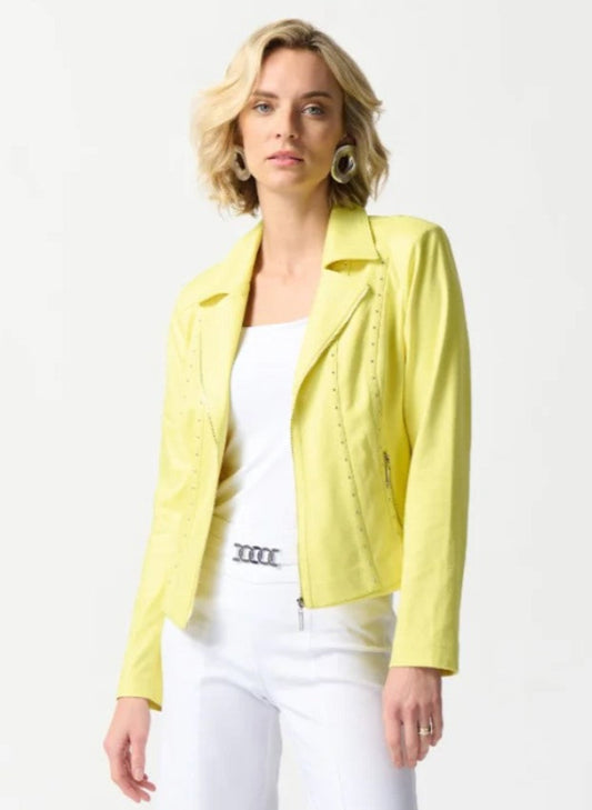 Woman wearing a yellow jacket over a white top on a white background