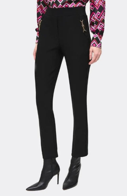 Black pants worn by a person on a white background