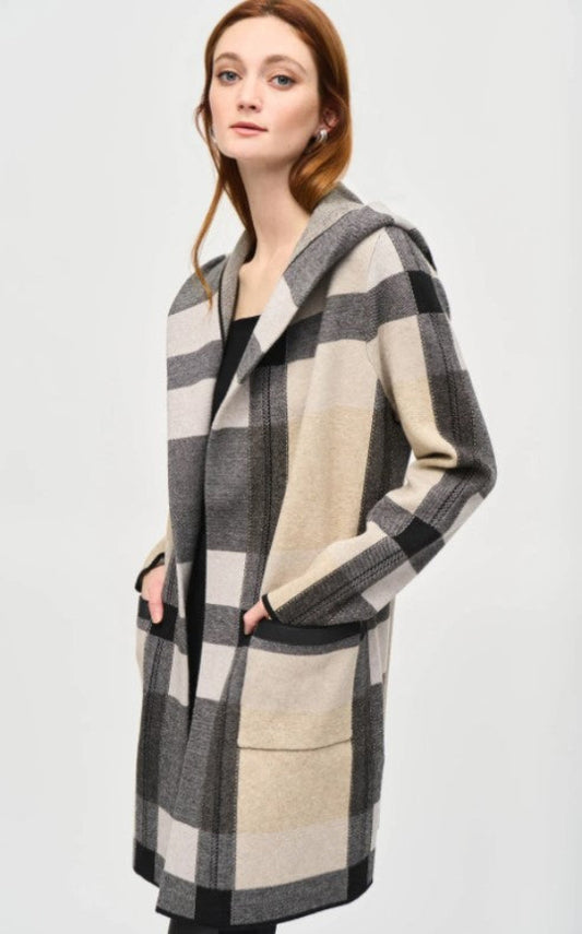 Woman wearing a checkered coat on a white background