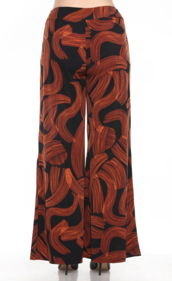 Wide-leg pants with brown abstract pattern on a black background