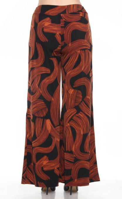 Wide-leg pants with brown abstract pattern on a black background