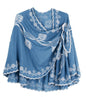 Blue cape with white floral embroidery on a white background